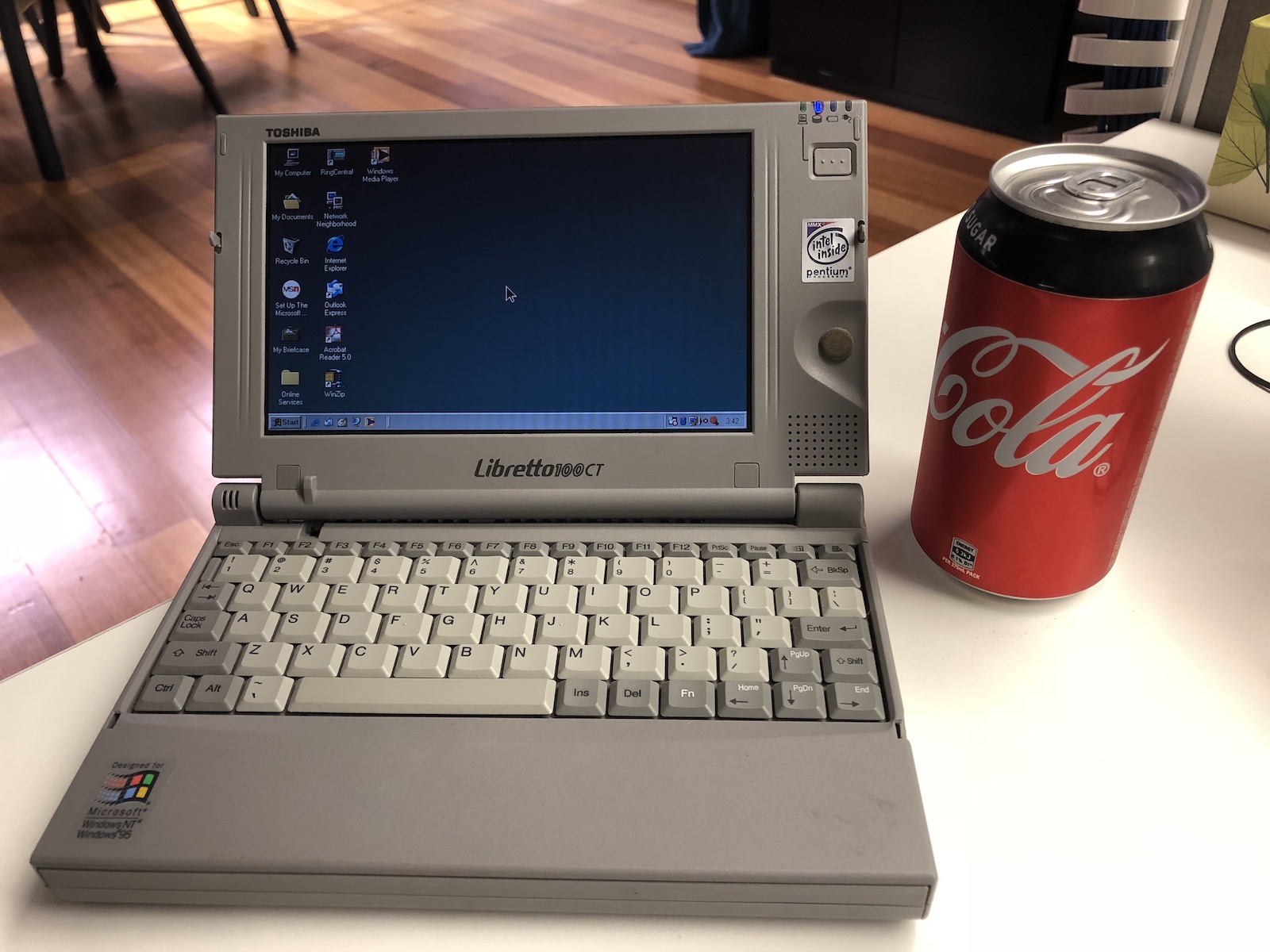 Toshiba Libretto with a Coca Cola can sitting next to it